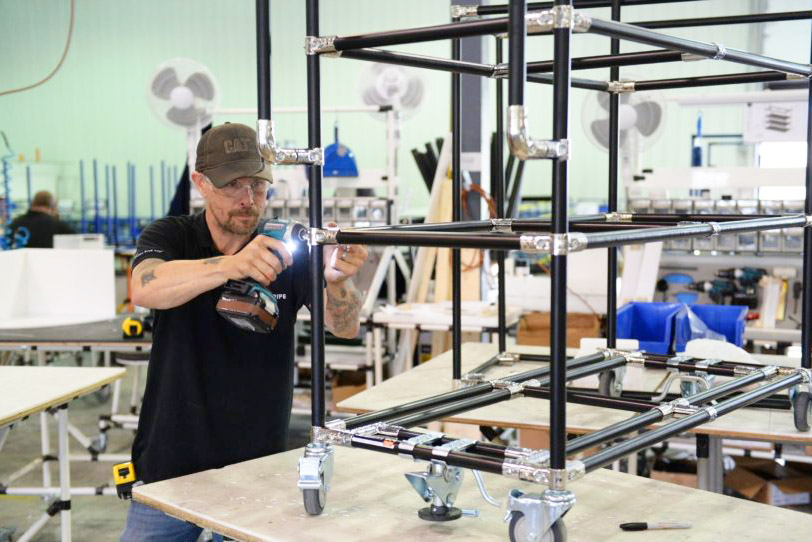 man assembling flexpipe workspace