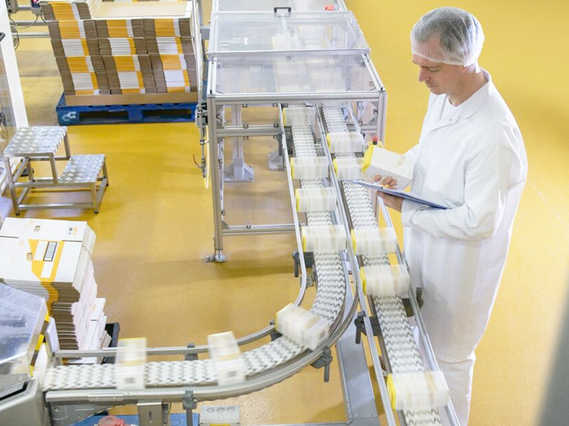 man packaging food products at plant