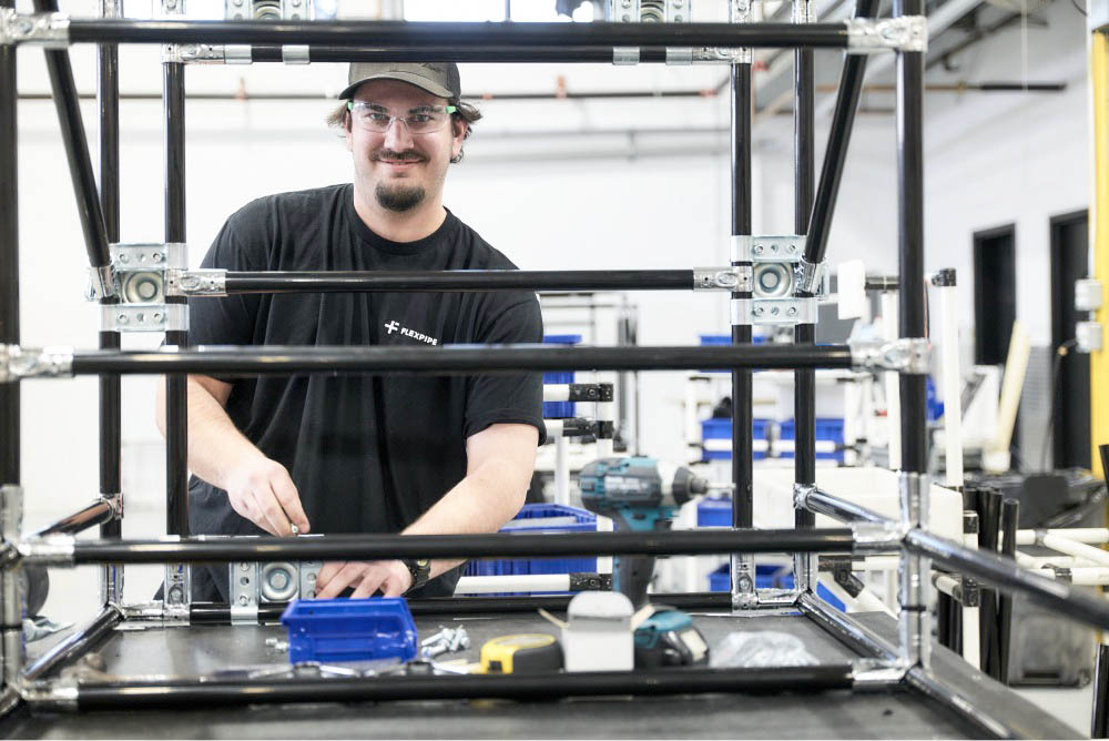man assembling a flexpipe fixture