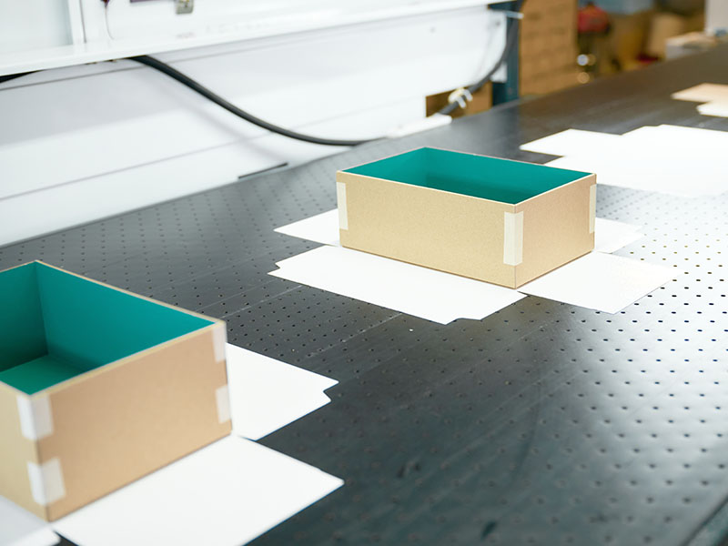 Cardboard box production line at a decorative packaging factory showcasing efficient workflow and precision craftsmanship