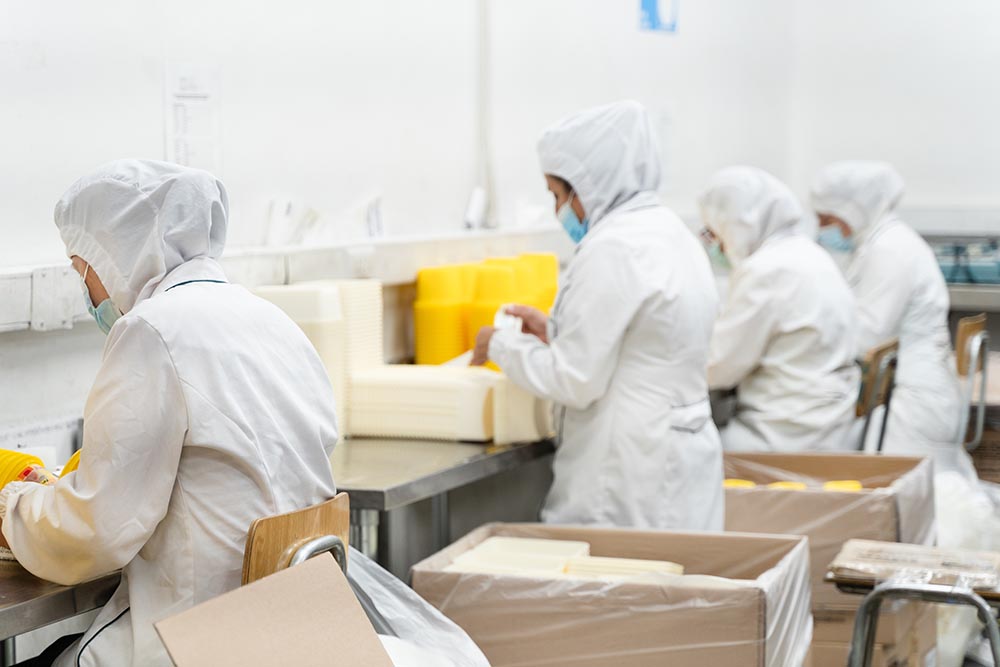 workers packaging medical equipment