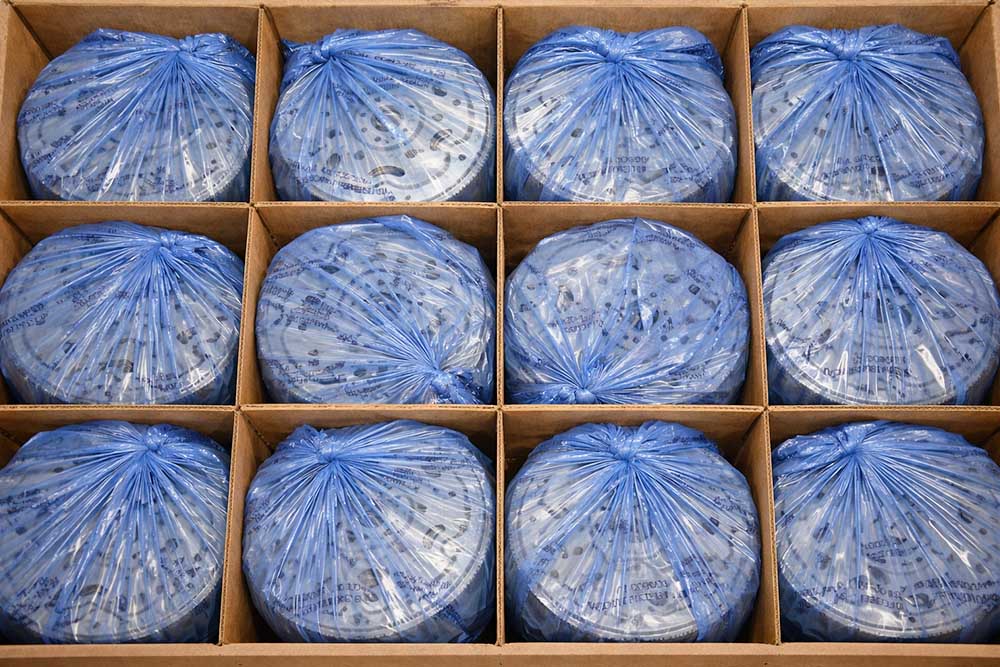 corrosion protected auto parts in partitioned cardboard box