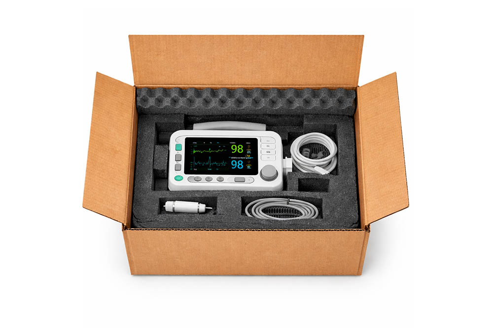 medical device protected in foam cushioning in cardboard box